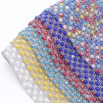 Close-up detail of pearl rhinestone sheet for accessory and garment decoration