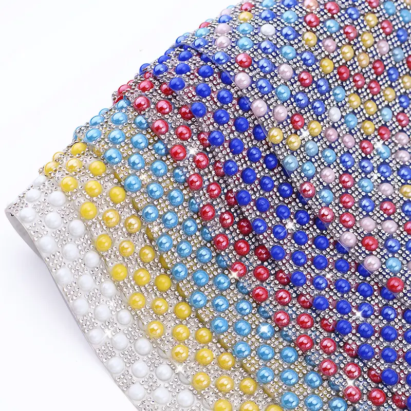 Close-up detail of pearl rhinestone sheet for accessory and garment decoration
